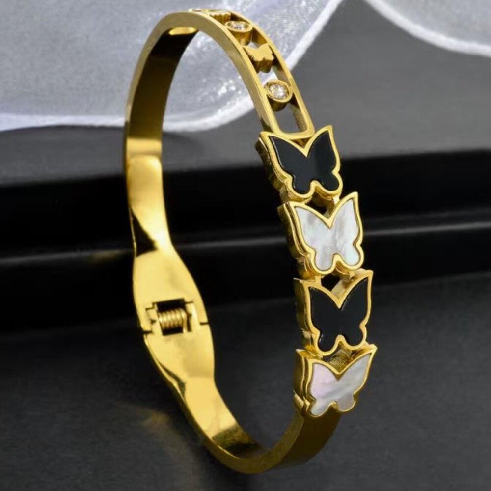 Exquisite Geometric Black and White Butterfly-Accented Stainless Steel Bracelet
